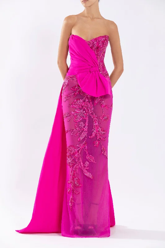 Tulle strapless, beaded dress with a taffeta draping and tail